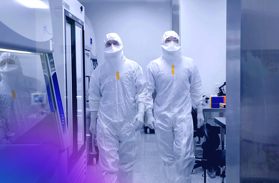 two scientists in a lab wearing white hazmat suits two scientists in a lab wearing white hazmat suits